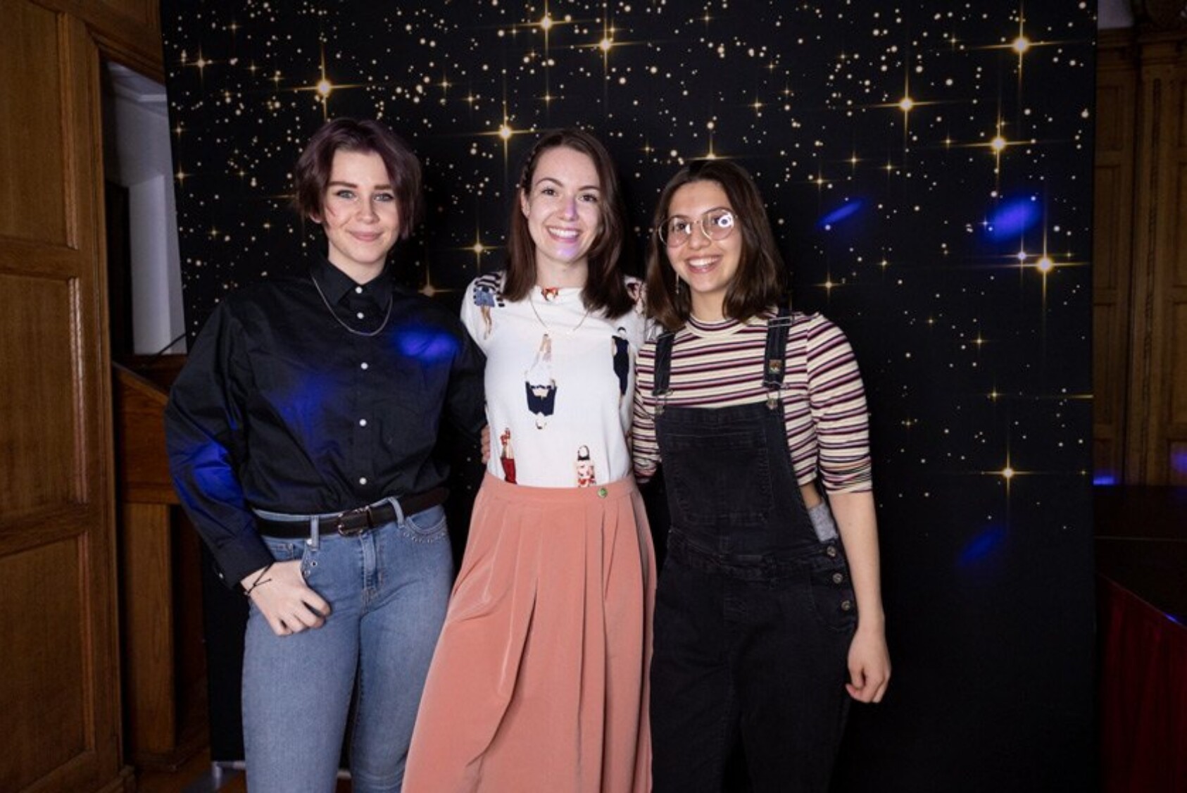 Alison Mangano ’23, Gabby D’Arcangelo MEng ’22, and Izzy LaHaye ’24 wear thrifted outfits and bright yellow Crocs Izzy borrowed from her younger brother (not shown)