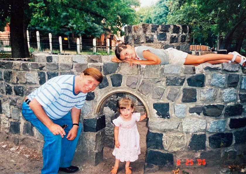 (L to R) Maryna’s father Vadim, her sister Emi, and Maryna in the park in Kharkiv, Ukraine, in June 2006