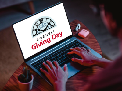 laptop screen with Giving Day logo