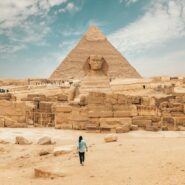 man walking towards the Great Pyramids
