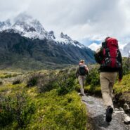 people walking towards mountains in Chile
