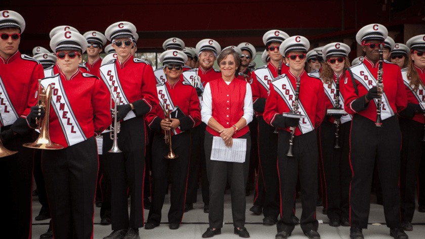 Susan H. Murphy ’73, PhD ’94 stands with the Big Red Band at the formal dedication of the Fischell Band Center in 2013