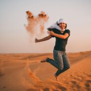 woman jumping in the desert