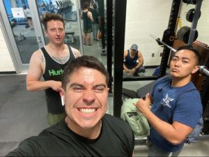 Matthew (right) at the gym with Michael Sanchez ’23 (left), Kyle Griswold ’25 (behind Michael), and Robbie Pollock ’23 (in the far back)