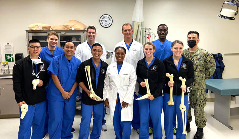 Matthew (bottom row, third from left) and the Naval Hospital Guam orthopedic surgical team