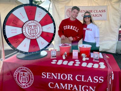 Senior Class Campaign co-chairs Daniel Morgan ’23 and Lauren Pappas ’23 staffing the SCC table during Homecoming 2022.