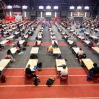 Students seated at long tables in Barton Hall