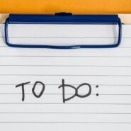 A clipboard with the words "to do" written on the page