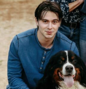 VITA volunteer James Herrmann (3L) and his dog Sully
