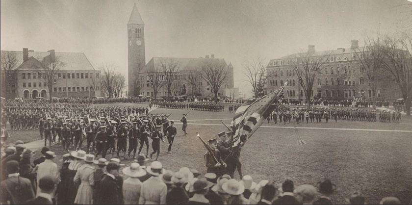 In the early days, all male students at Cornell were required to complete two years of mandatory military drill and military sciences classes. Here, the ‘Corps of Cadets’ march around the Arts Quad. Source: https://armyrotc.cornell.edu/the-legacy/.