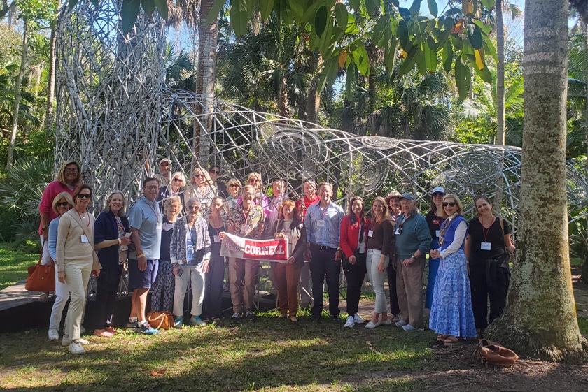 McKee Garden attendees gather for a group photo with the Cornell banner