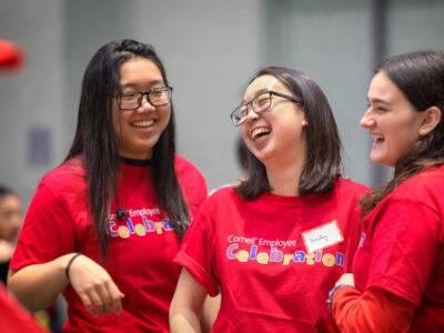 Student volunteers share a light moment during Winter Employee Celebration.