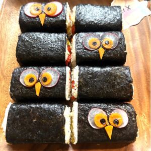 A local favorite, musubi, artfully assembled by Alex Moore. Traditionally, musubi is made with Spam, but Alex used mango, pineapple, and roasted red pepper instead.
