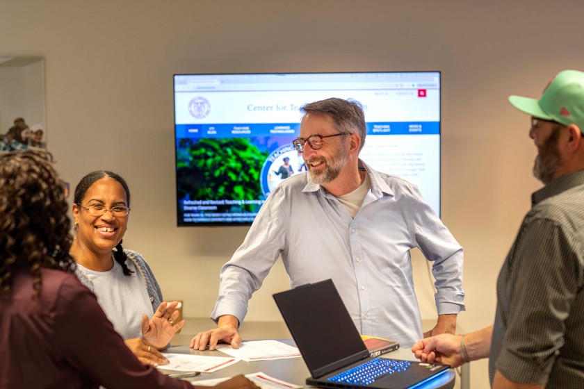 Steve Jackson (center), vice provost for academic innovation, meets with members of the Center for Teaching Innovation team: (from L to R) Adara Alston, Leslie Williams, and James Whalley.