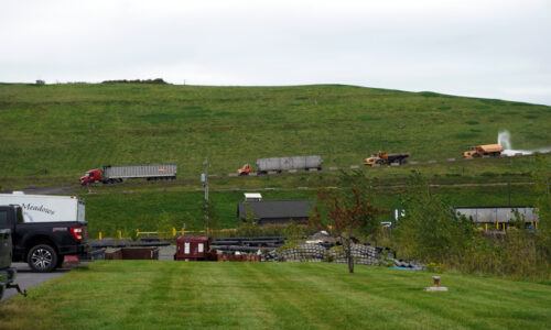 A line of trucks on their way to Seneca Meadows landfill to dump waste