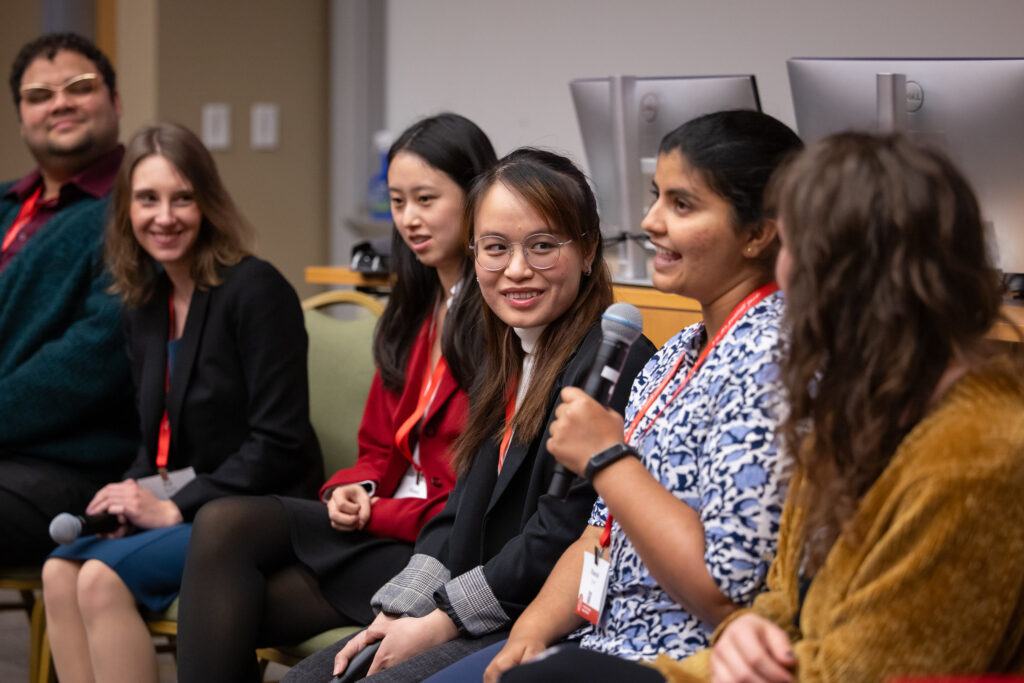 Three-Minute Thesis Session - TCAM 2024 - photo of panelists speaking