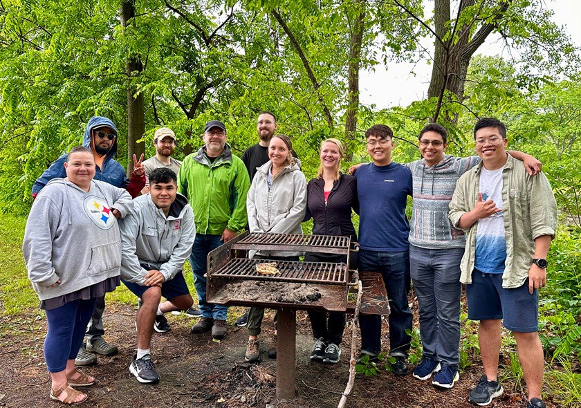 Cornell Veteran’s Summer Bridge Program BBQ in Taughannock Park. Mary Fisk (far left), student veteran program director, and Kyle Downey (in green jacket), director for transfer/veteran admissions, joined participants and student ambassadors.