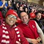 Morgan Jones MBA ’15 (L) and Matt Carcella (R), senior director of diversity and U.S. regional alumni engagement, enjoy Cornell’s victory over Boston University at Red Hot Hockey in Madison Square Garden in 2023.