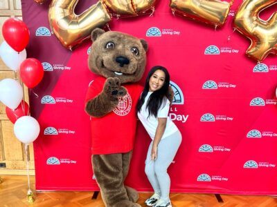 Vianny Lara ’25 poses for a photo with Touchdown on Giving Day 2024.