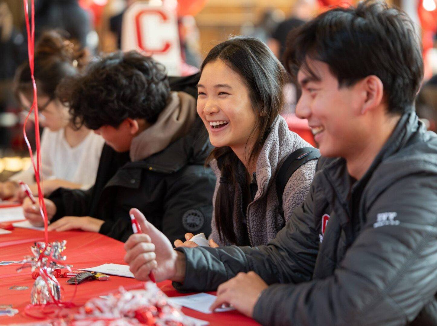 Students write thank you postcards on Giving Day