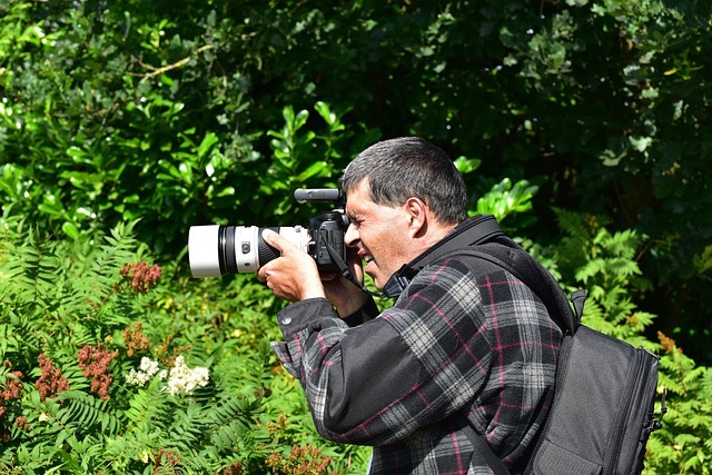 man taking photos in nature
