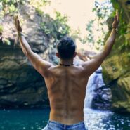 Man swimming in natural waterhole