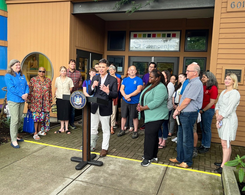 Senator Lea Webb honored the Ithaca Sciencenter with the New York State Empire Award in August 2024. Eric (at the podium), chair of the Sciencenter’s board of trustees, makes remarks on behalf of the center.