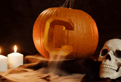 Halloween pumpkin with Cornell C carved into it and smoke pouring out
