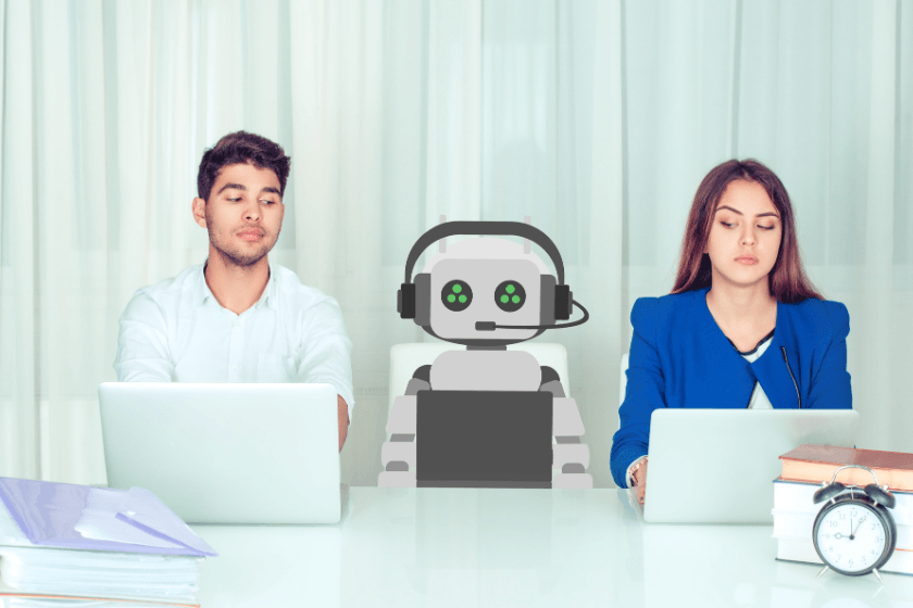 Two young workers sitting at a desk and eyeing a robot sitting in the middle.