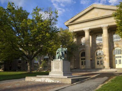 Ezra Cornell statue in front of Goldwyn Smith Hall
