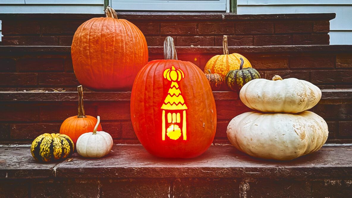 carved gourds lit up on steps