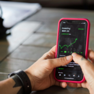 Close up of phone with Investing on screen