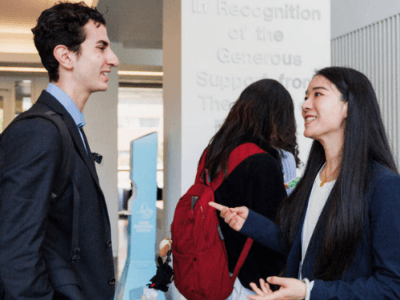 Student connecting with an employer at a career fair