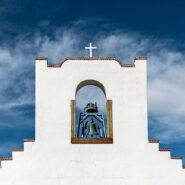 White washed structure against blue New Mexico sky