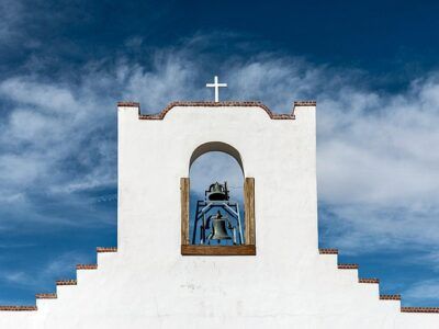 White washed structure against blue New Mexico sky