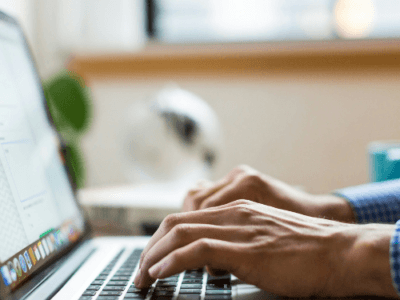 Person typing on laptop