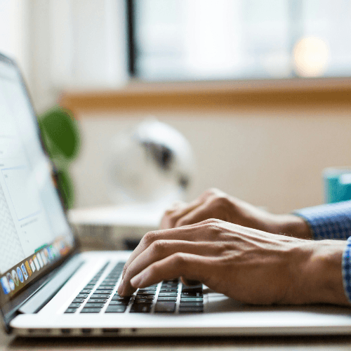 Person typing on laptop