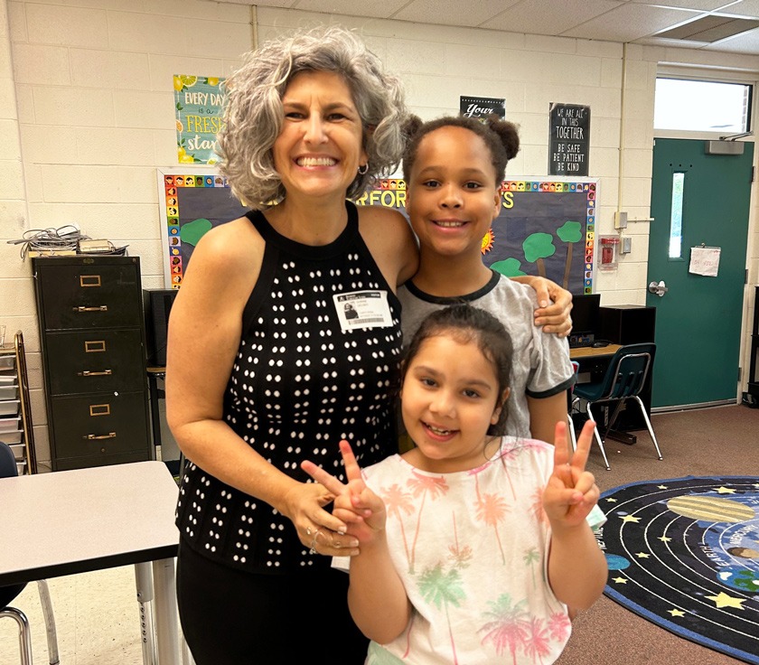 The good Cornellians can do: Dorine Colabella ’91 – Dorine Colabella '91 with two of the students she tutors. “It’s hard to explain what it feels like to see the pride in their faces when they know they’re becoming a stronger reader,” she says.