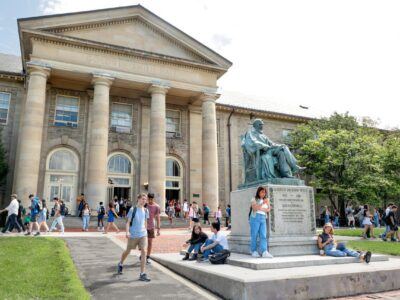 Students are seen in between classes on on the Arts Quad on the first day of Fall Semester.
