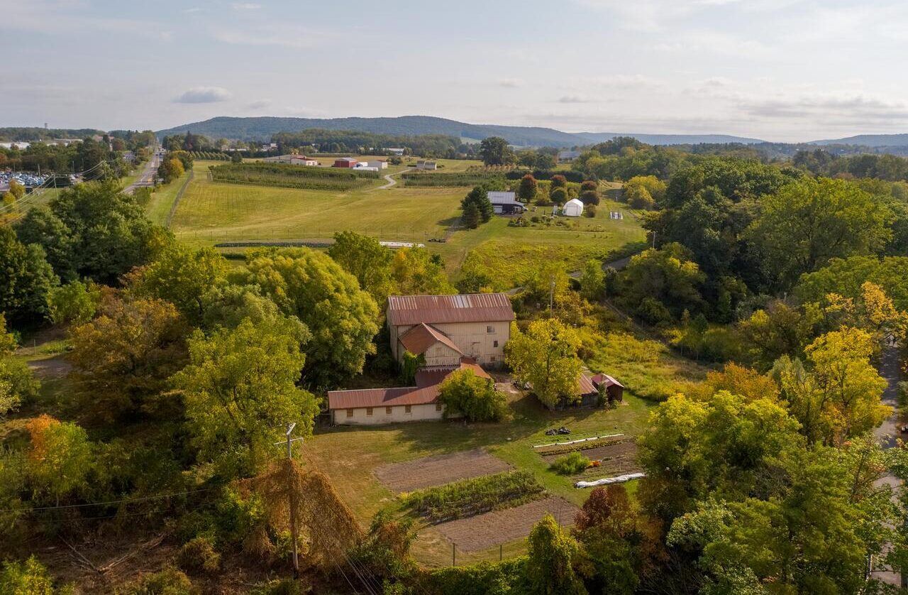 Aerial view of Dilmun Hill farm with Cornell Orchards in the distance.