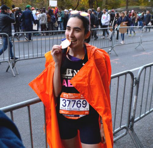 Abby Macaluso ’20 celebrates after completing the NYC Marathon in 2024.