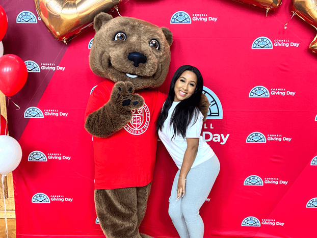 Vianny Lara ’25 posing with the Touchdown mascot