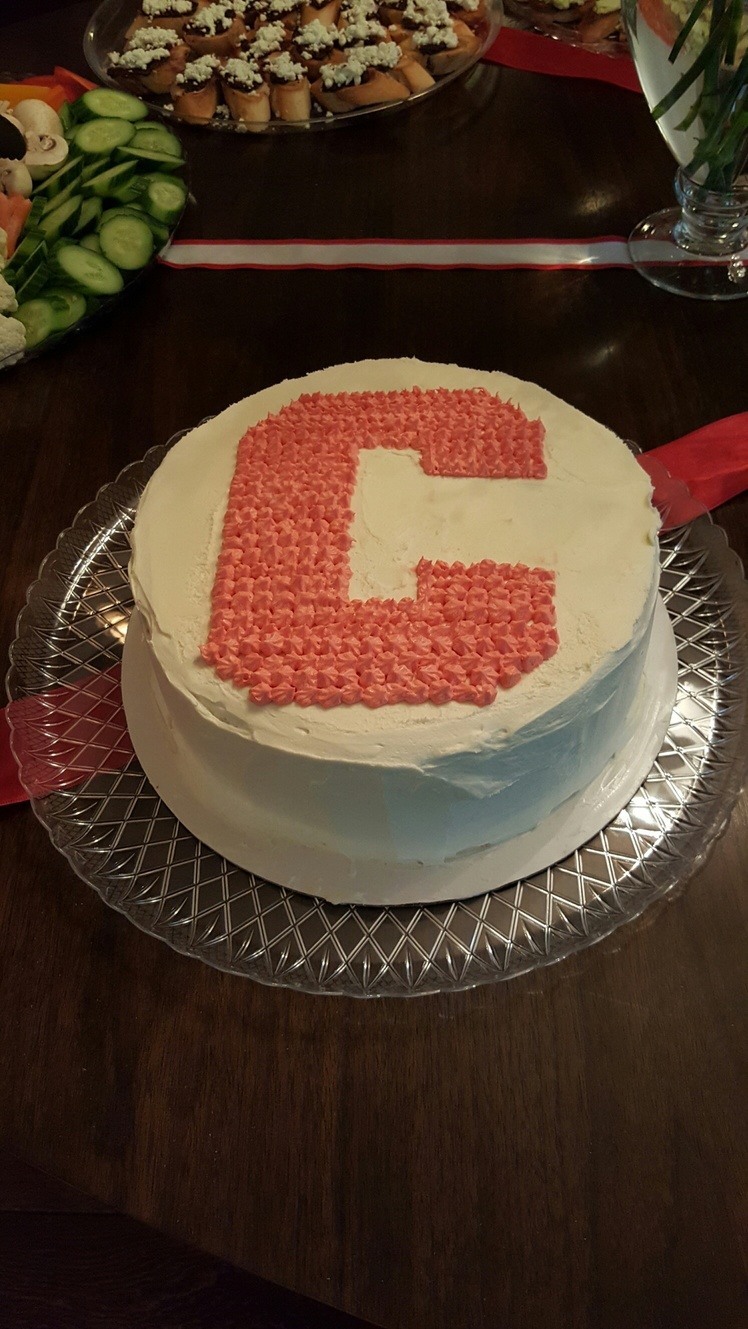 Cake with large C written in icing on top