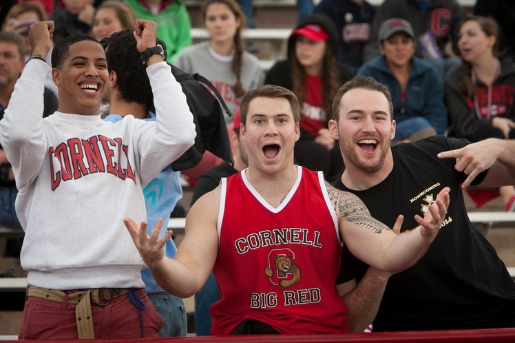 Three Cornellians showing Cornell pride