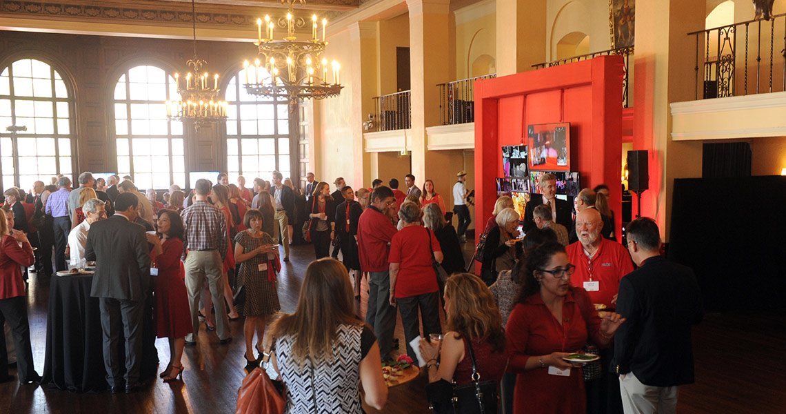 Cornellians mingle at the reception area, waiting for the show to begin.