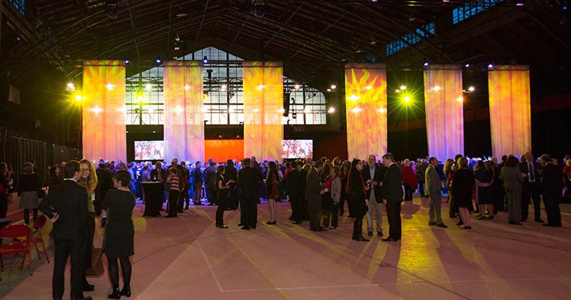 Trustees and members of the Cornell University Council gather in Barton Hall before a dinner during TCAM weekend. 